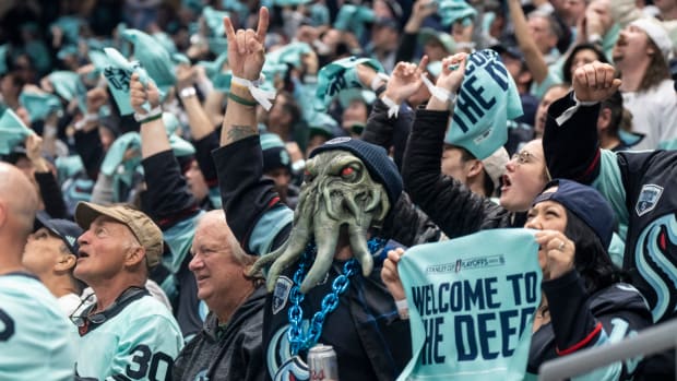 Fans celebrate a Seattle Kraken goal during game three of the second round of the 2023 Stanley Cup Playoffs.
